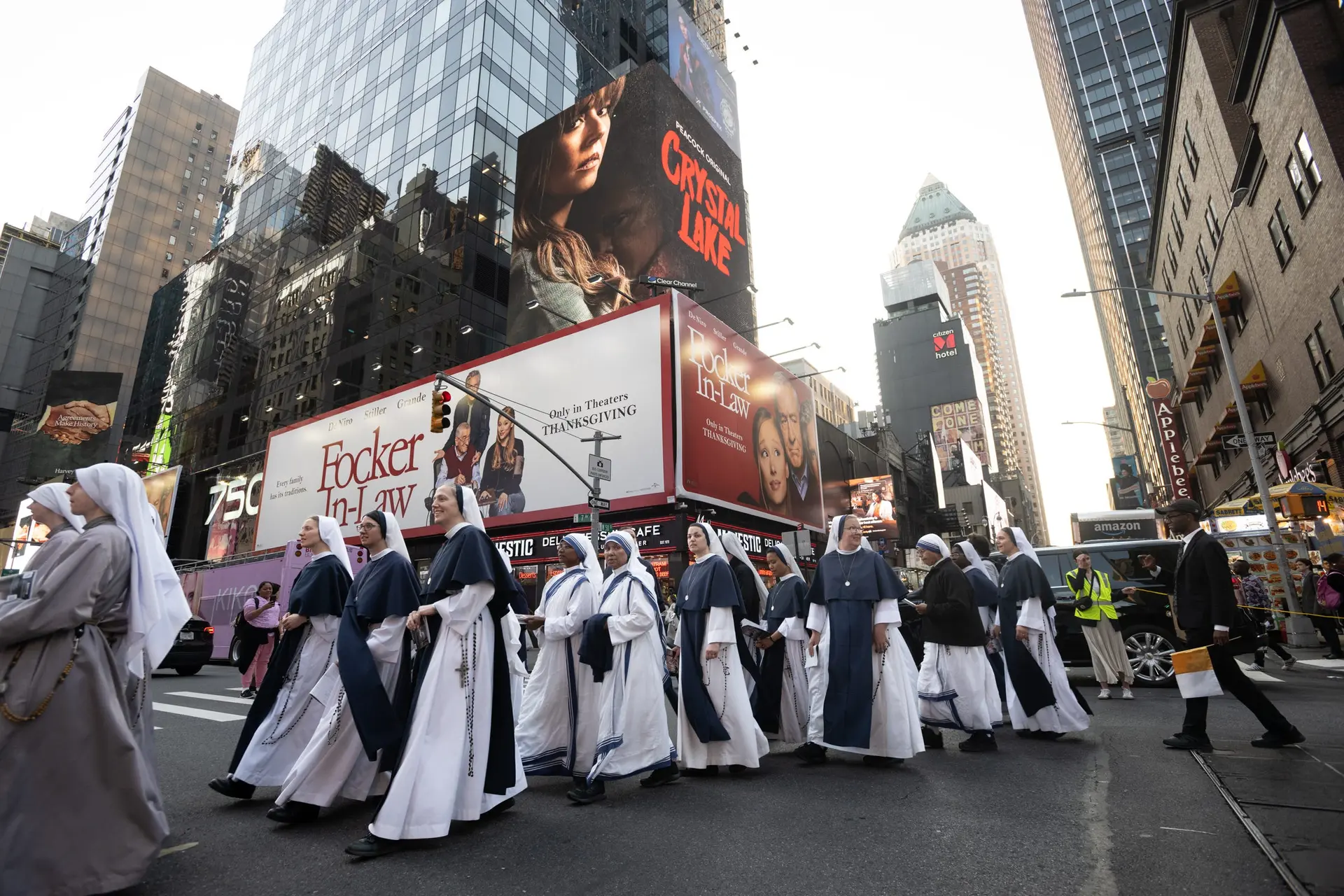Beneath Times Square’s towering billboards, the Sisters of Life walk with rosaries in hand. Prayer becomes visible at street level. | Credit: Jeffrey Bruno